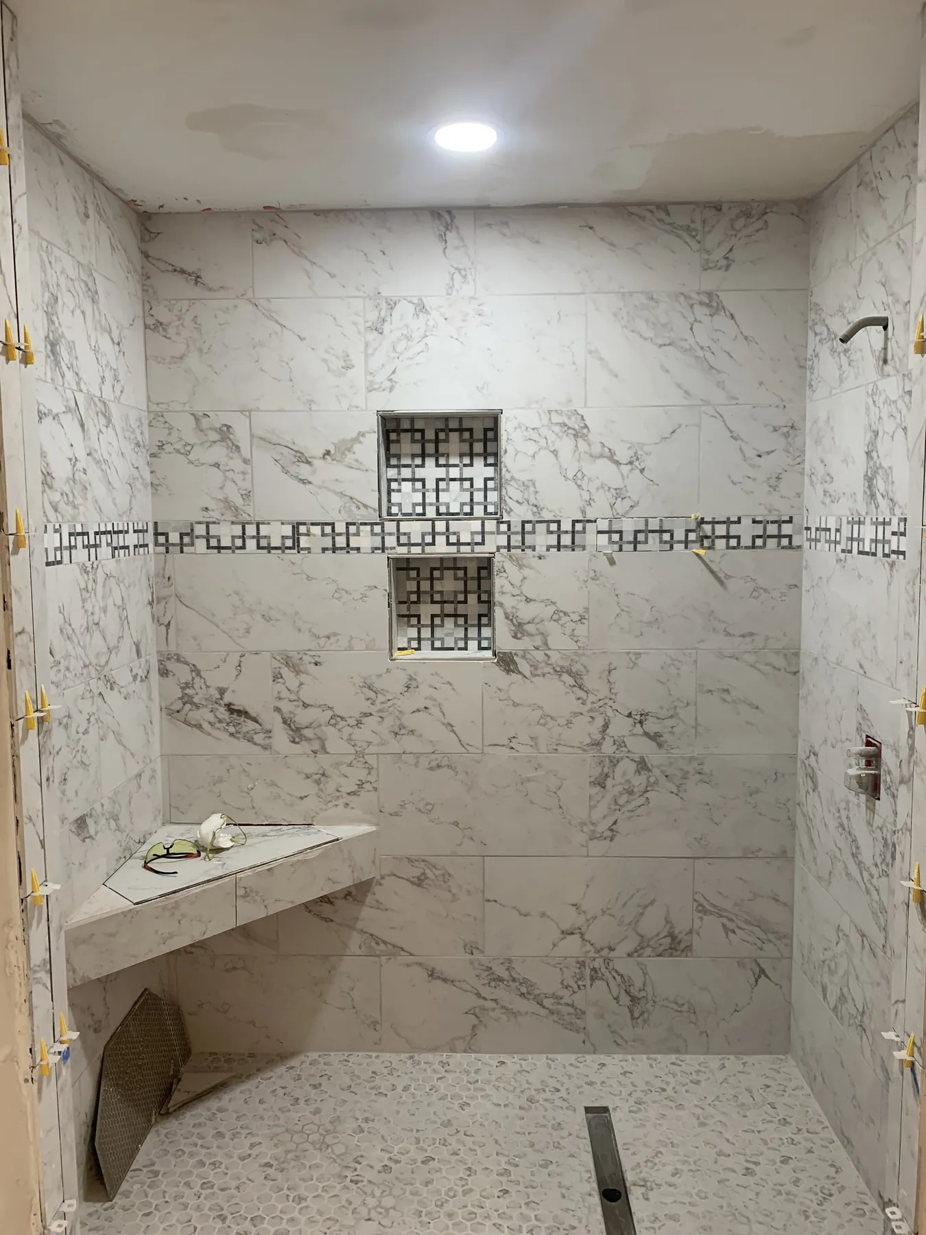 Walk-in shower and bench installation in progress