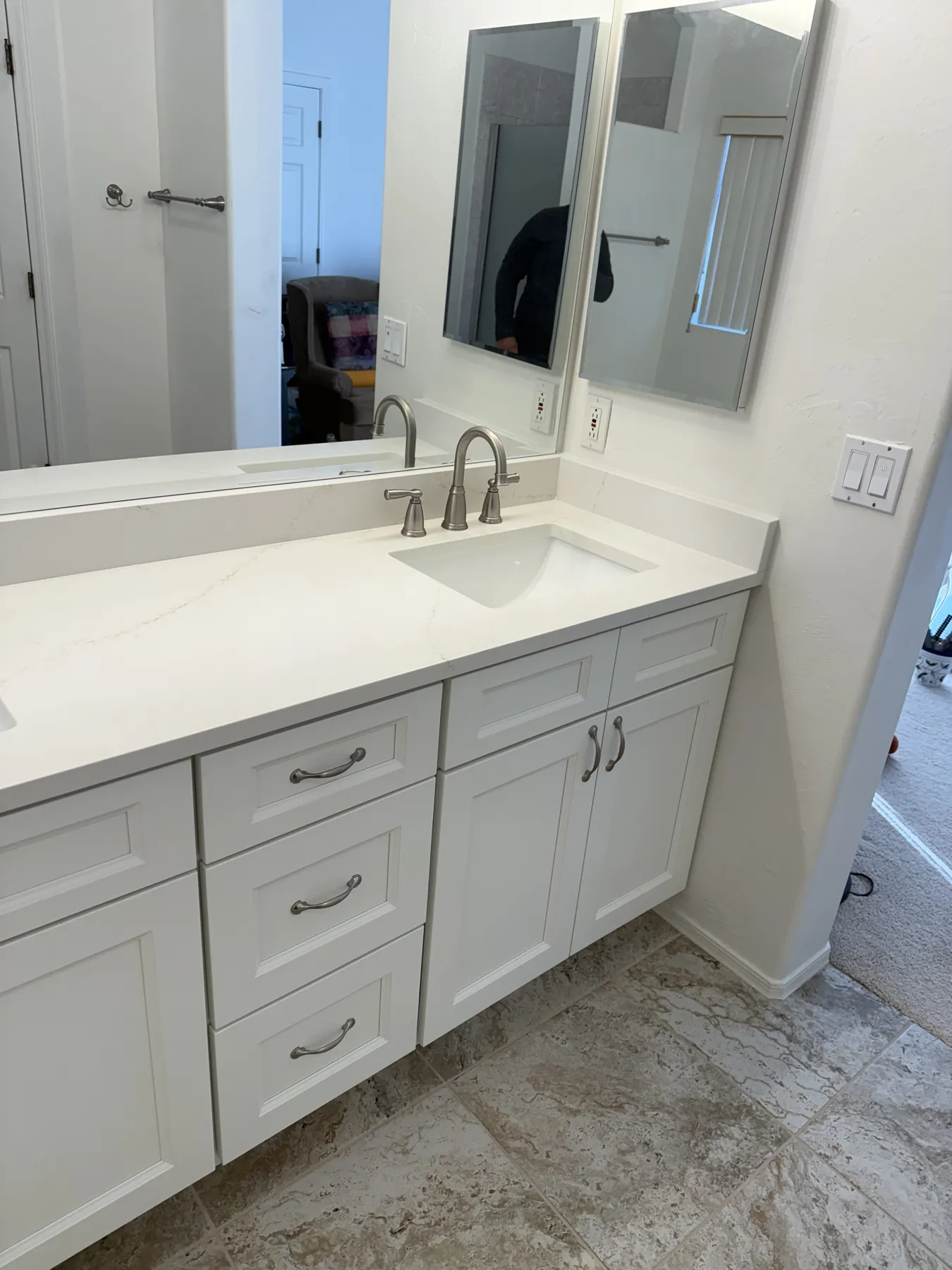 Completed white bathroom vanity and stone countertop