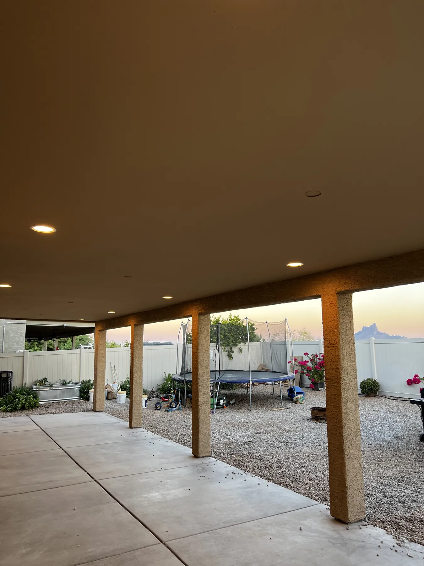 Completed covered deck addition viewed from the yard