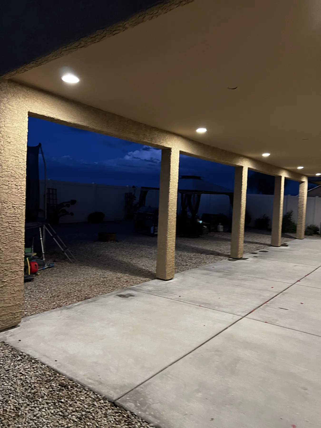 Finished covered deck illuminated at night