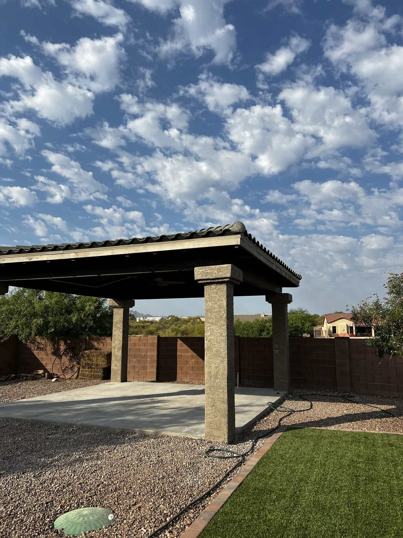 Completed freestanding ramada viewed across the yard
