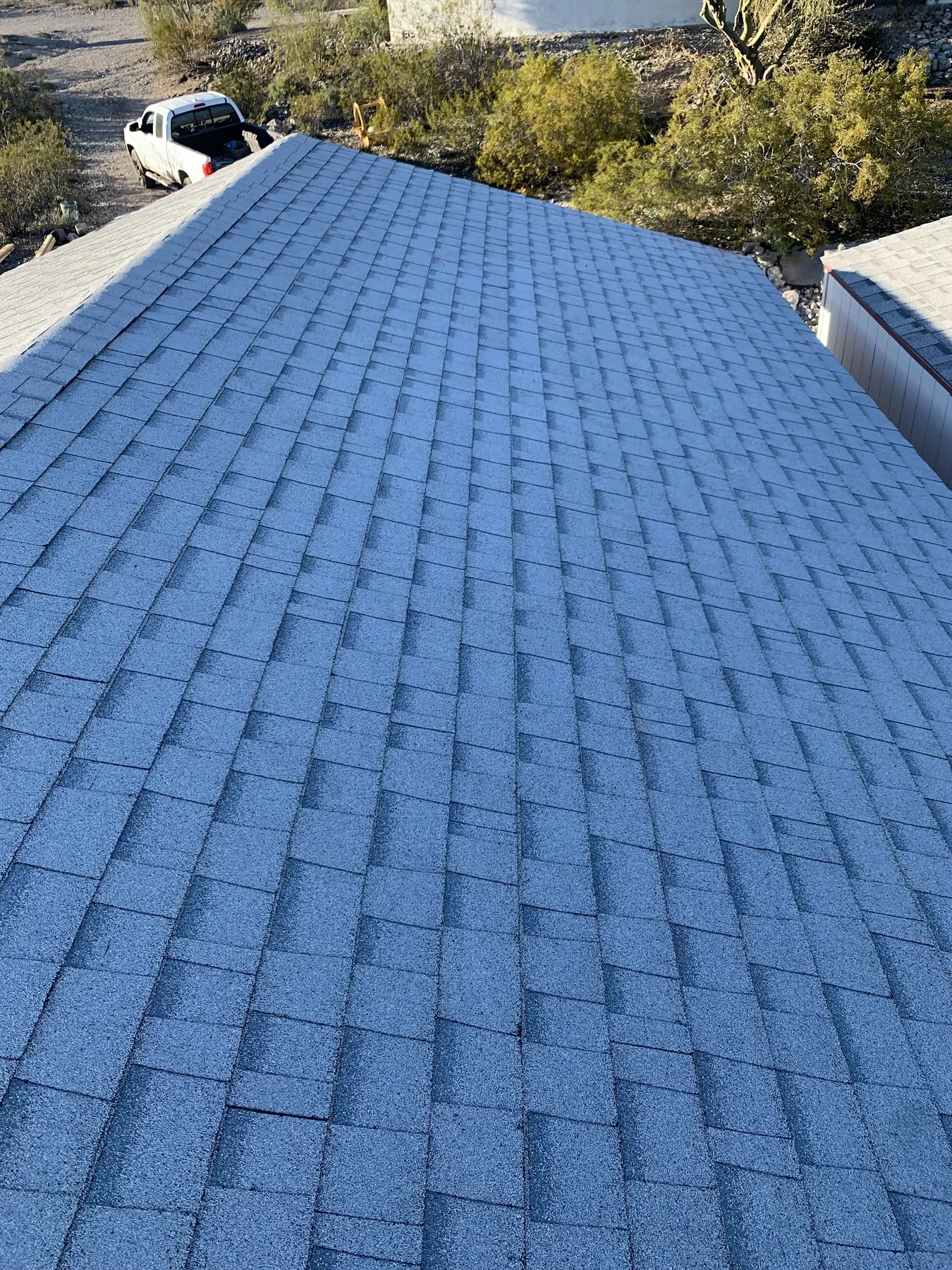 Storage structure roof shingles during the documented enclosure phase