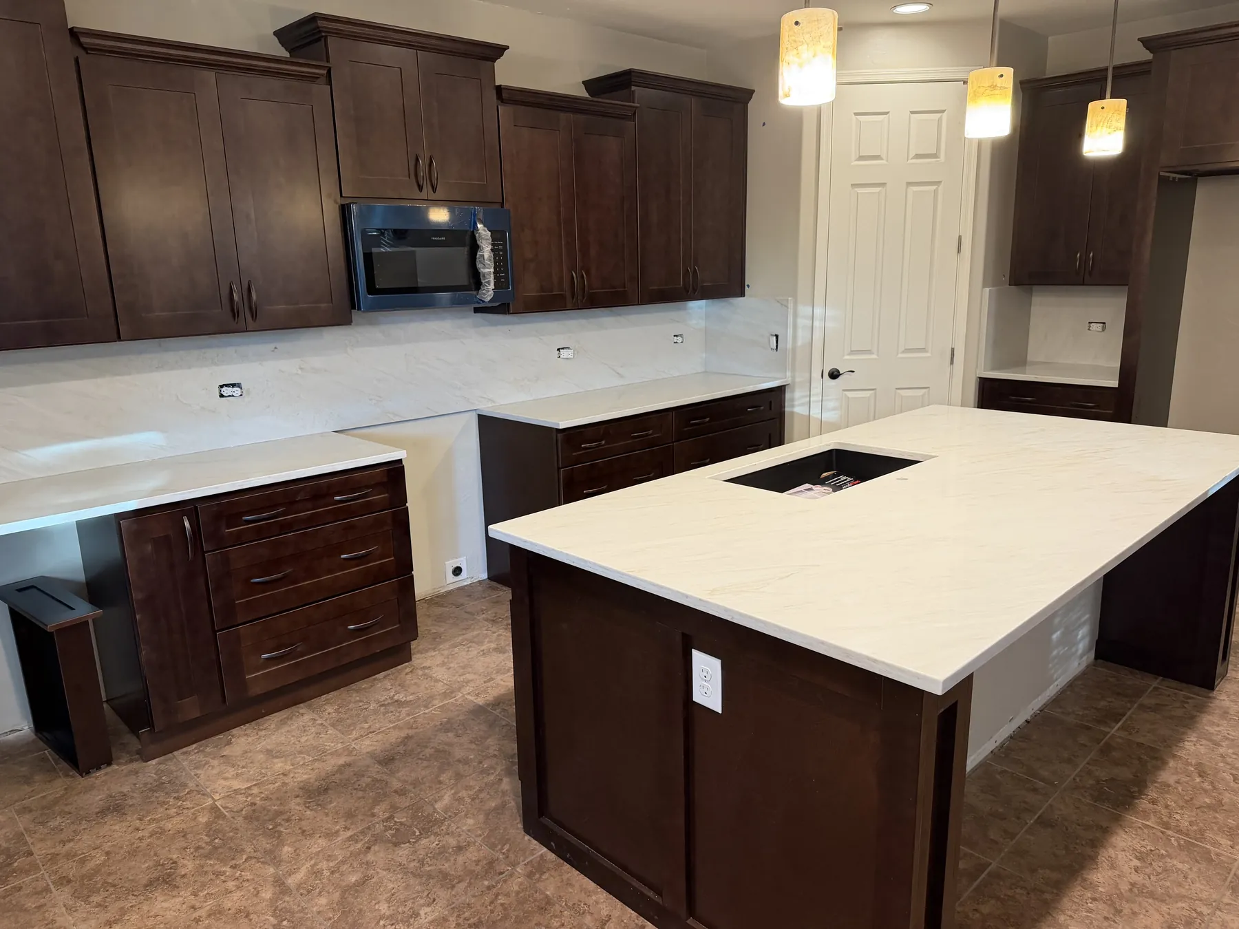 Kitchen island, cabinetry and countertop installation