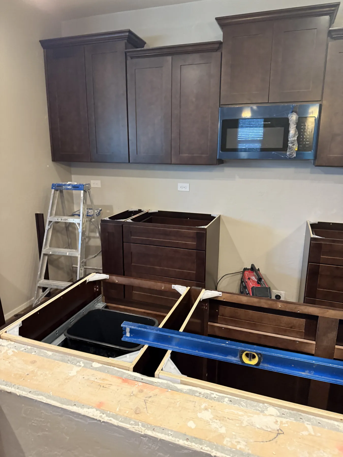 Dark wood kitchen cabinetry configuration detail