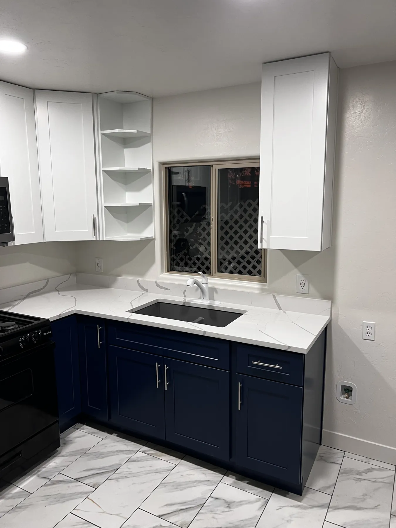 Two-tone kitchen cabinetry with integrated wine storage