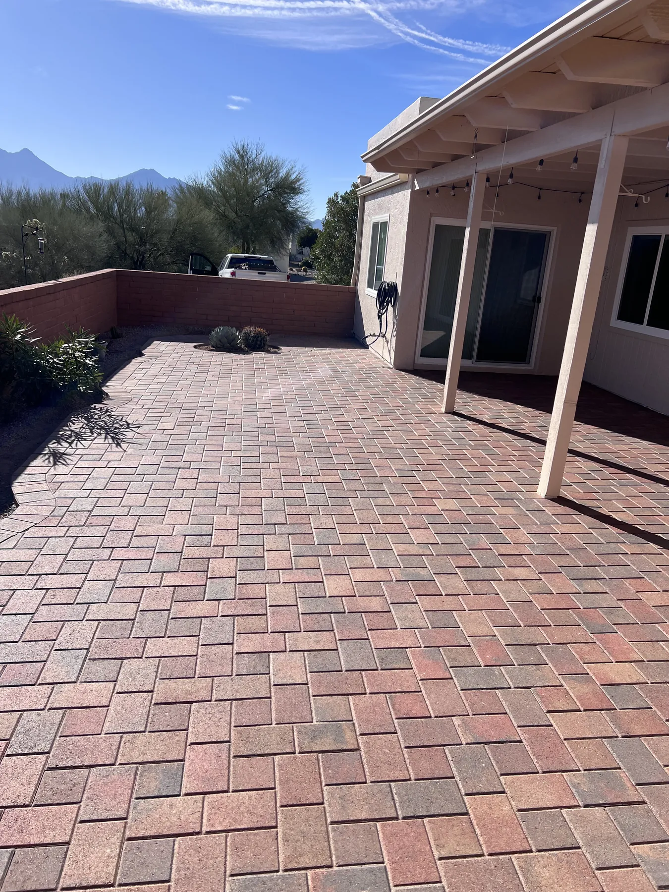 Completed paver courtyard connecting the home and patio