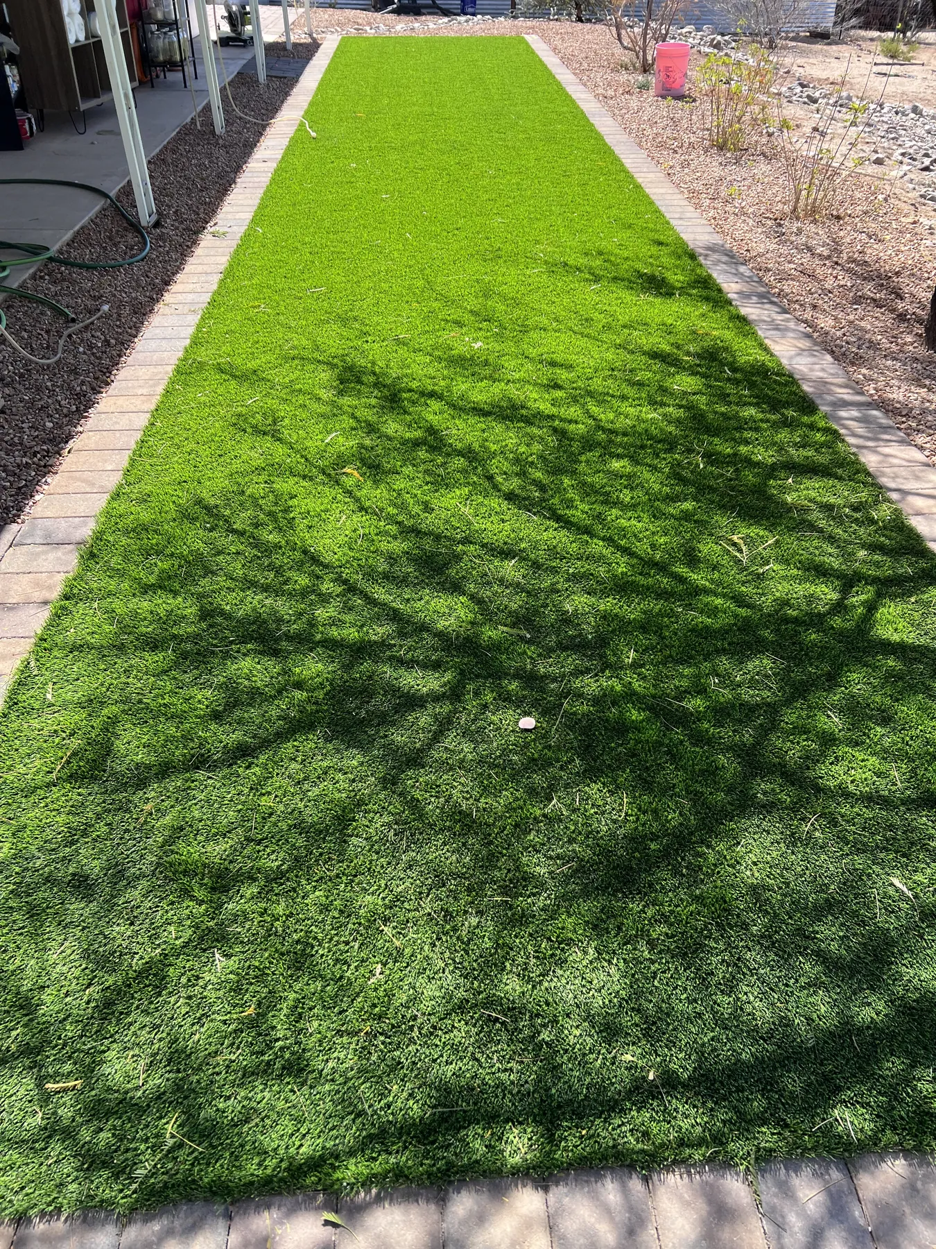 Completed low-maintenance turf and hardscape landscape