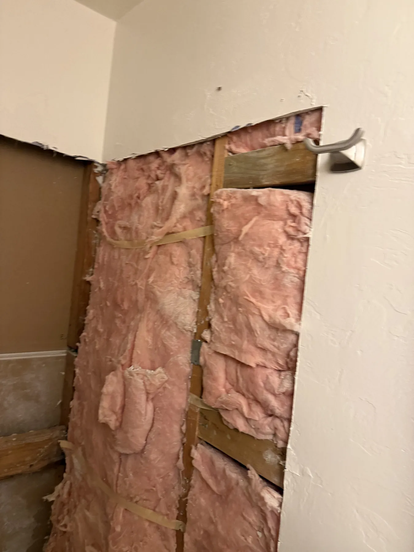 Exposed wall cavity during restoration inspection