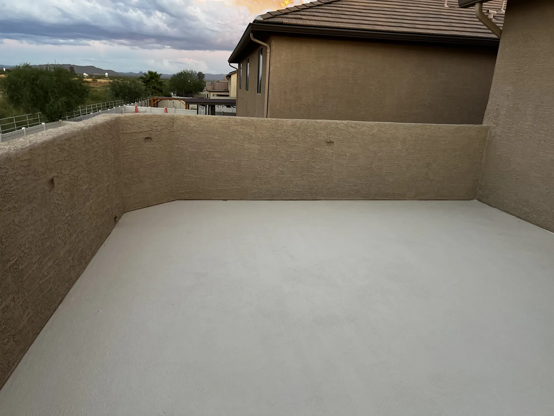 Completed bright roof coating across a residential terrace