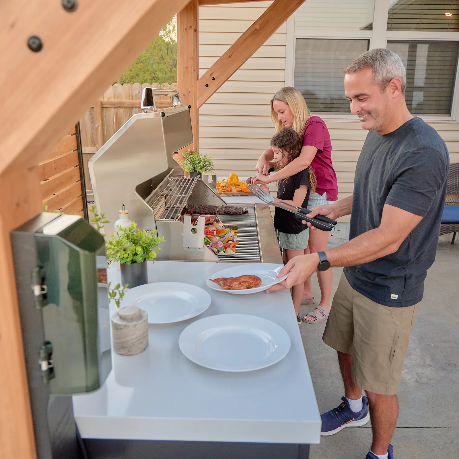 Backyard Discovery Timber Rock Grill Station in a family outdoor cooking setting