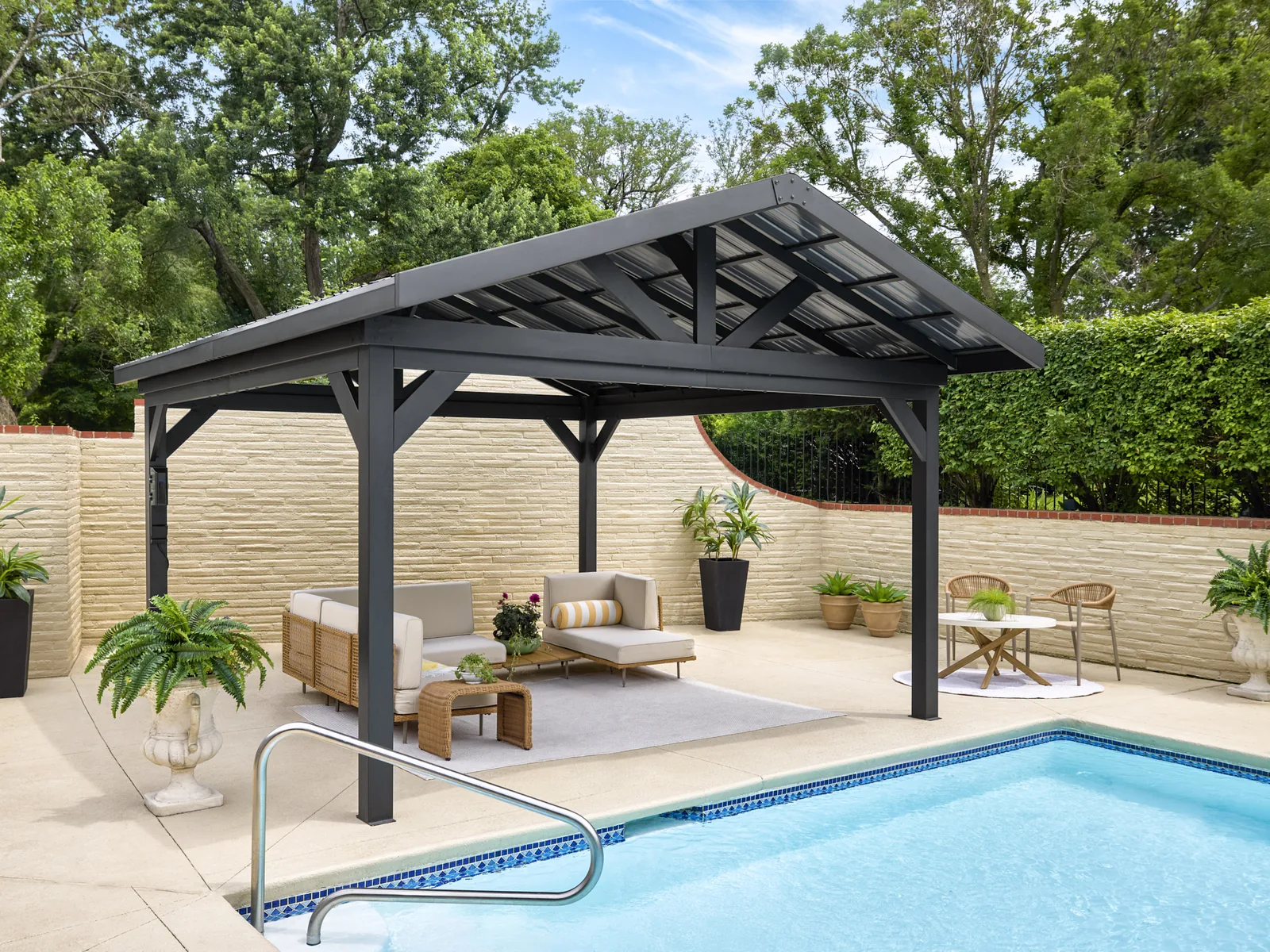 RANGE Lancaster black steel gazebo beside a pool